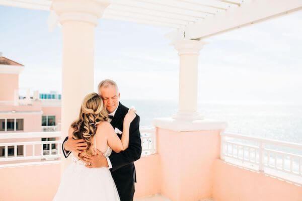 bride having a first look with her father