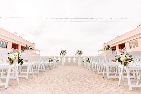 white wedding ceremony decor on the sky terrace at the Hyatt Clearwater beach