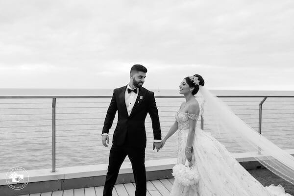 Bride and groom on the terrace at the Opal Sands Resort on Clearwater Beach