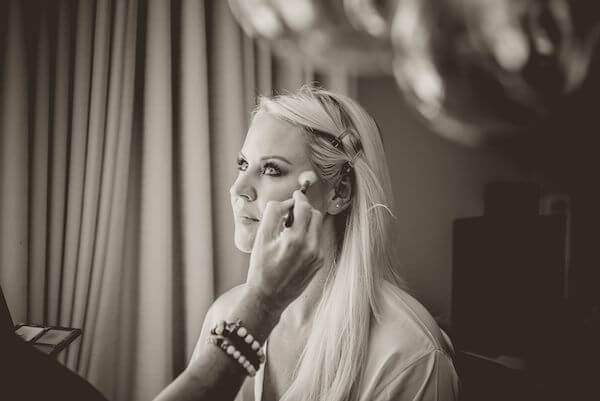 bride having makeup done on her wedding day in Clearwater Beach 