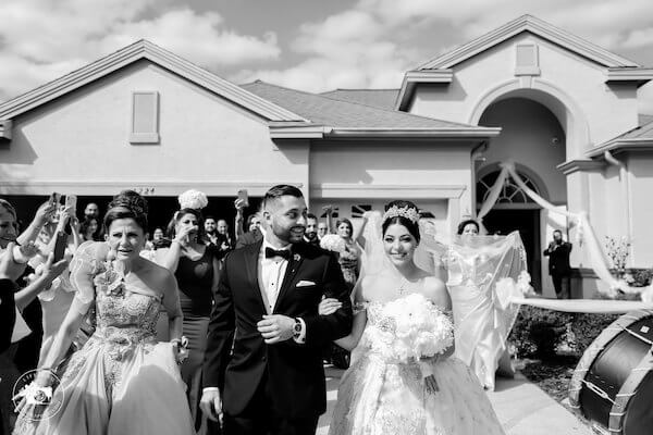 bride being escorted to her fairytale Clearwater Beach wedding