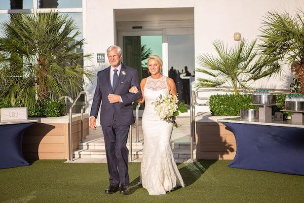 Bride walking down the aisle at her Clearwater Beach wedding ceremony