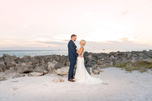 bride and groom at sunset on Clearwater Beach