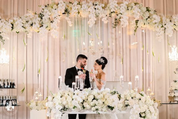 bride and room at their fairytale sweetheart table at their Clearwater Beach wedding