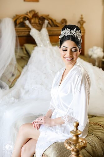 fairytale bride posing for photos in white robe