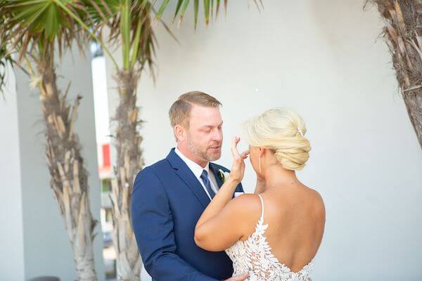 emotional bride and groom during their first look at the Opal Sands Clearwater Beach