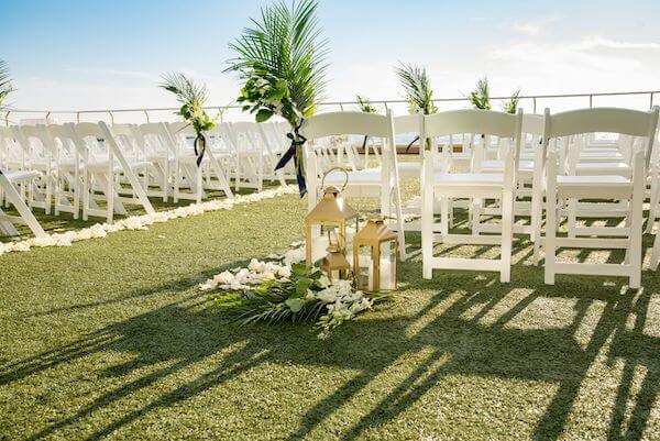 Outdoor white and gold wedding ceremony at the Opal Sands Resort on Clearwater Beach