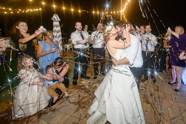 bride and groom acing under a shower of steamers at their Saint Petersburg wedding