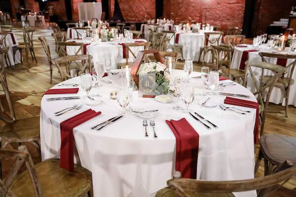 Tampa Armature Works wedding reception with rustic chairs and hexagon centerpieces