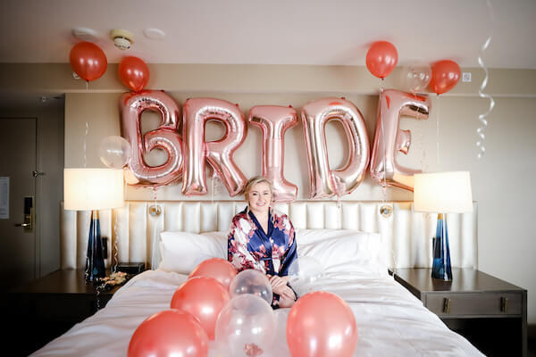 Tampa ride with colorful balloons getting ready for her wedding day