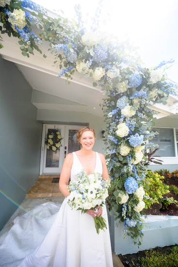 bride outside of her parents Saint Petersburg home on her wedding day