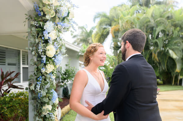 bride and groom laughing after their first look