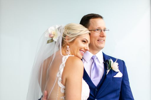 bride and groom posing for photos at the Opal Sands Resort on Clearwater Beach