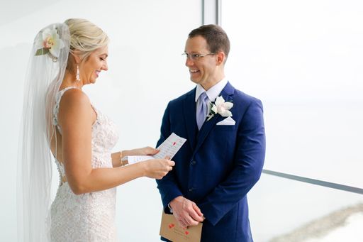 bride and groom reading the notes they have written for each other