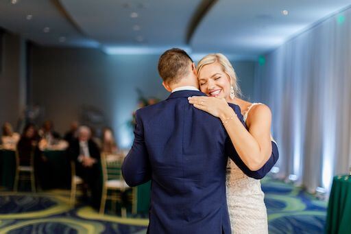 smiling bride as she dances her first dance