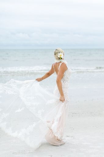 bride twirling her wedding gown on Clearwater Beach