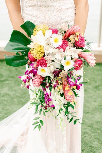 Clearwater Beach bride's cascading bridal bouquet filled with pin cushion protea orchids and ginger