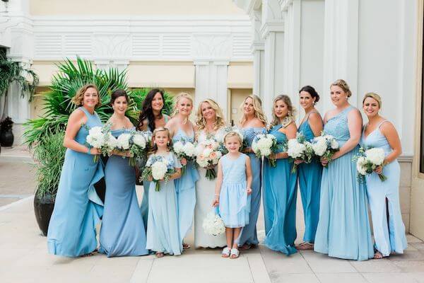 Clearwater Beach destination wedding party wearing beautiful dresses in shades of blue