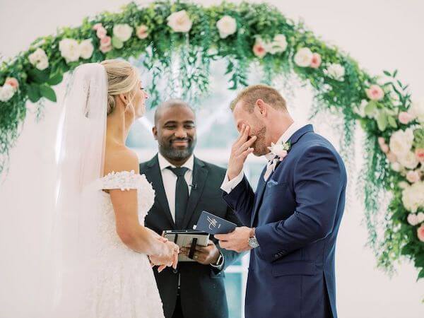 emotional groom breaking down during his wedding vows at Harborside Chapel