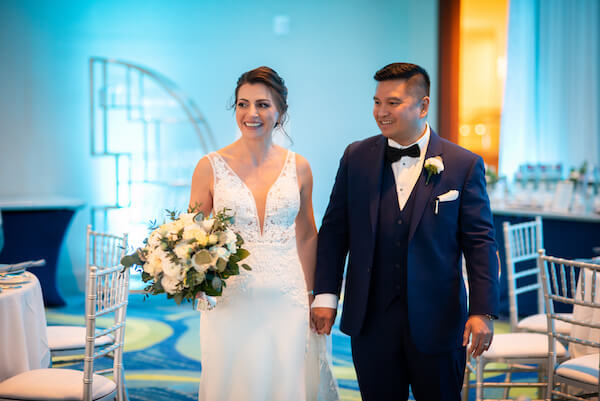 bride and groom getting a sneak peek at their wedding reception at the Opal Sands Resort in Clearwater Beach