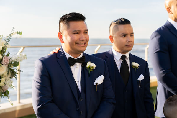 anxious groom waiting for his bride at their Opal Sands wedding ceremony