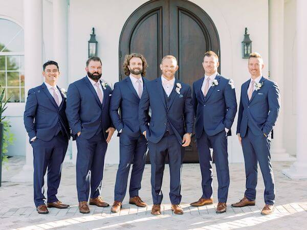 Groom and Groomsmen in navy-blue suits at Harborside Chapel in Safety Harbor