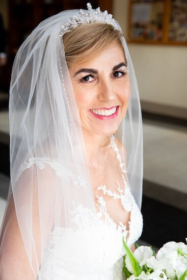 Tampa bride wearing a white lace wedding gown and a rhinestone tiara