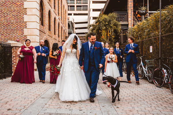 newlyweds and their wedding party had off for photos with their dog after their downtown St Pete rooftop wedding ceremony