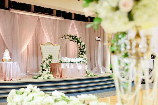 Luxurious Tarpon Springs wedding decor in gold, white and soft pink with a magnificent sweetheart table