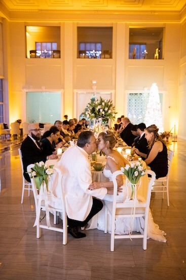 bride and groom kissing at their intimate Tampa wedding reception