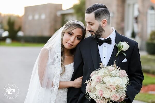 Tarpon Springs bride and groom taking wedding portraits