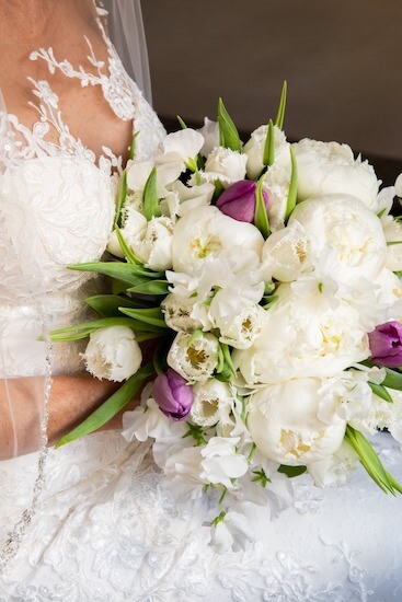 romantic bridal bouquet with frilly white tulips, peonies and sweetpeas