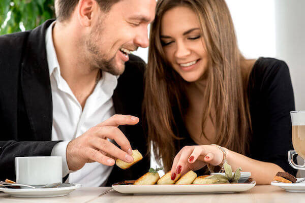 young couple tasting foods for their wedding reception