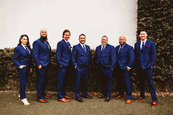 groom and his wedding party dressed in blue suits getting ready for his downtown St Pete wedding