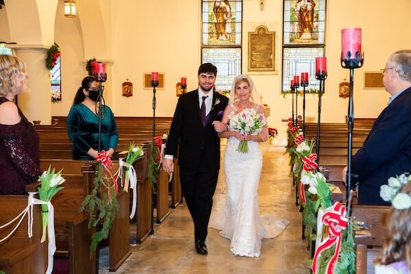 Tampa bride being escorted down the aisle by her son