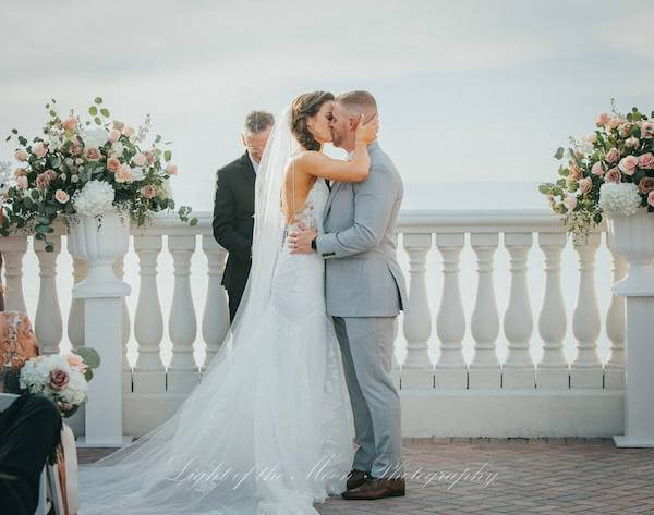 just married! Bride and groom kiss after their Hyatt Clearwater Beach wedding