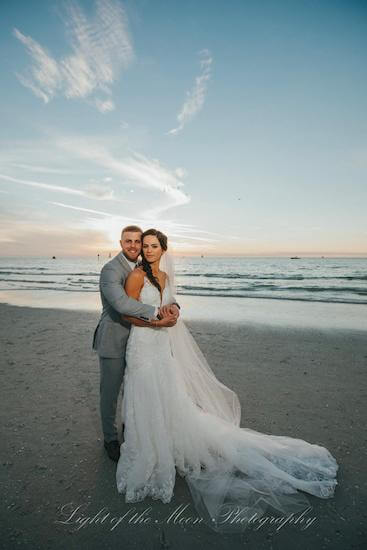 bride and groom at sunset on Clearwater Beach