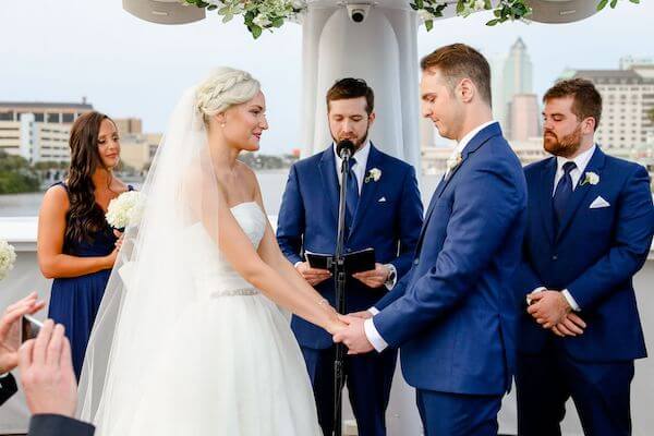 bride and groom exchanging wedding vows on the upper deck of the Yacht StarShip in Tampa