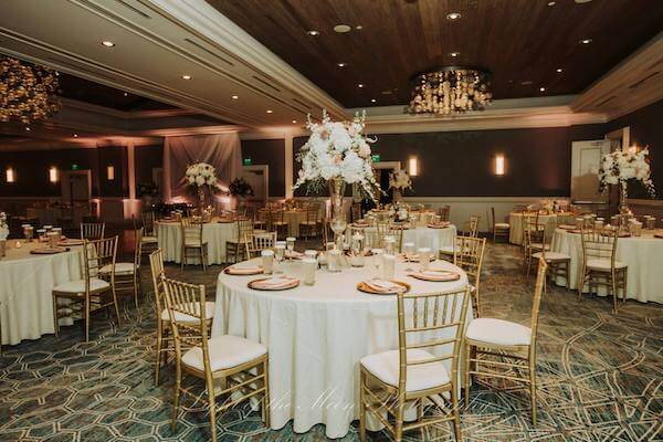 ballroom at the Hyatt Clearwater Beach set in gold, white and antique pink