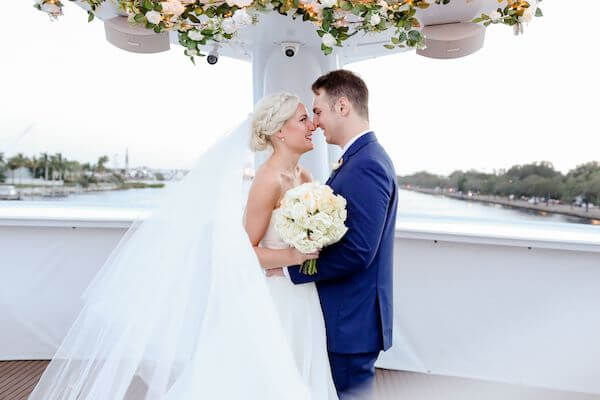 bride and groom on the bow of the Yacht StarShip in Tampa