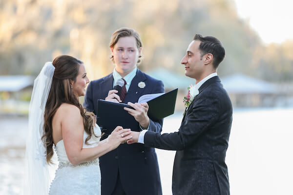 bride and groom exchanging wedding vows along the waterfront