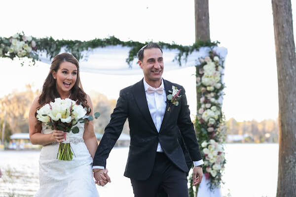 smiling bride and groom after their first kiss