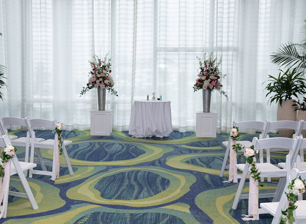 Indoor wedding ceremony at the opal sands resort was the couple's plan b