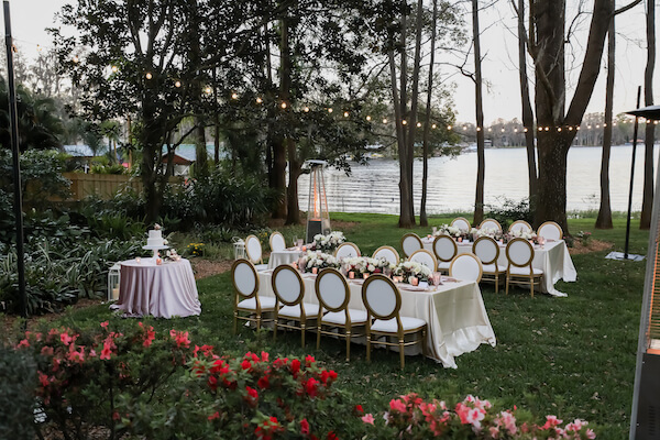 intimate backyard wedding reception with waterfront views