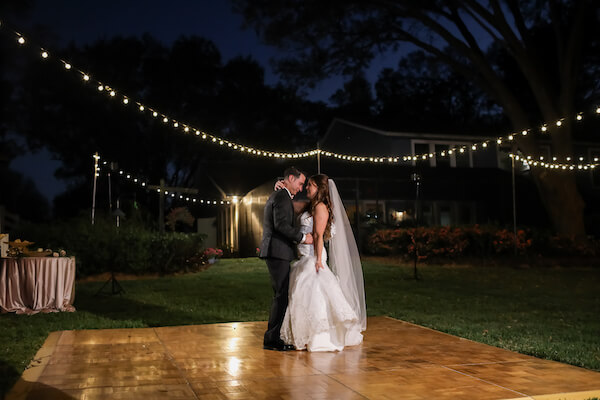 bride and groom having their first dance under the stars at their Tampa Bay intimate wedding