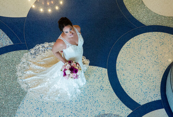 overhead view of a bride on an blue mosaic floor