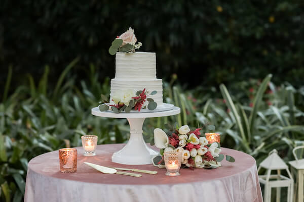 two tiered white wedding cake for an intimate at home wedding