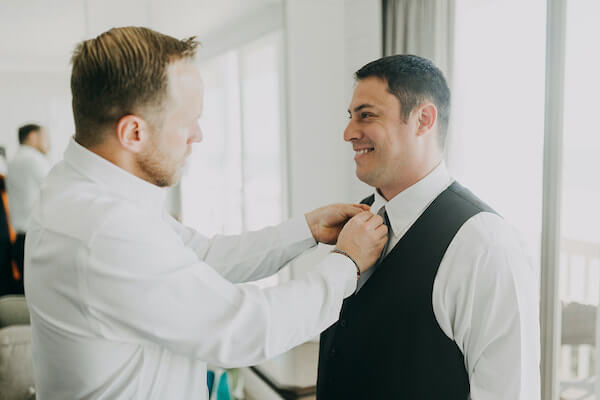 best man adjusting the groom's tie