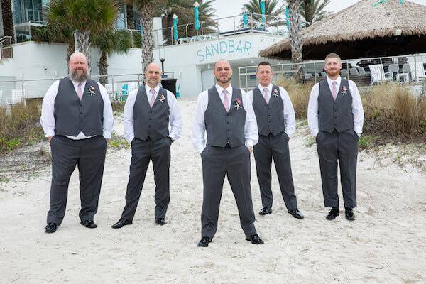 Groom with groomsmen outside the Opal Sands Resort