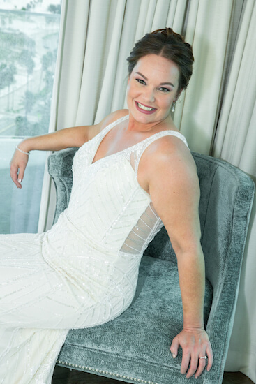 bride posing in her bridal suite before her first look